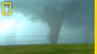 Tornadoes Lightning in Rare Video  National Geographic [upl. by Pontius]